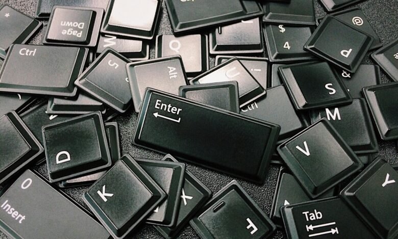 A pile of computer keyboard keys jumbled together